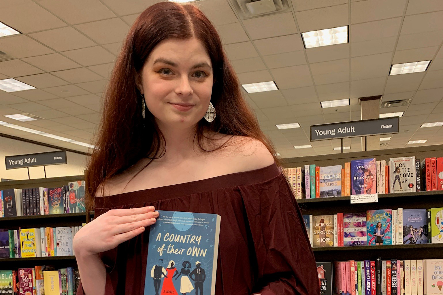 Girl poses with book she wrote