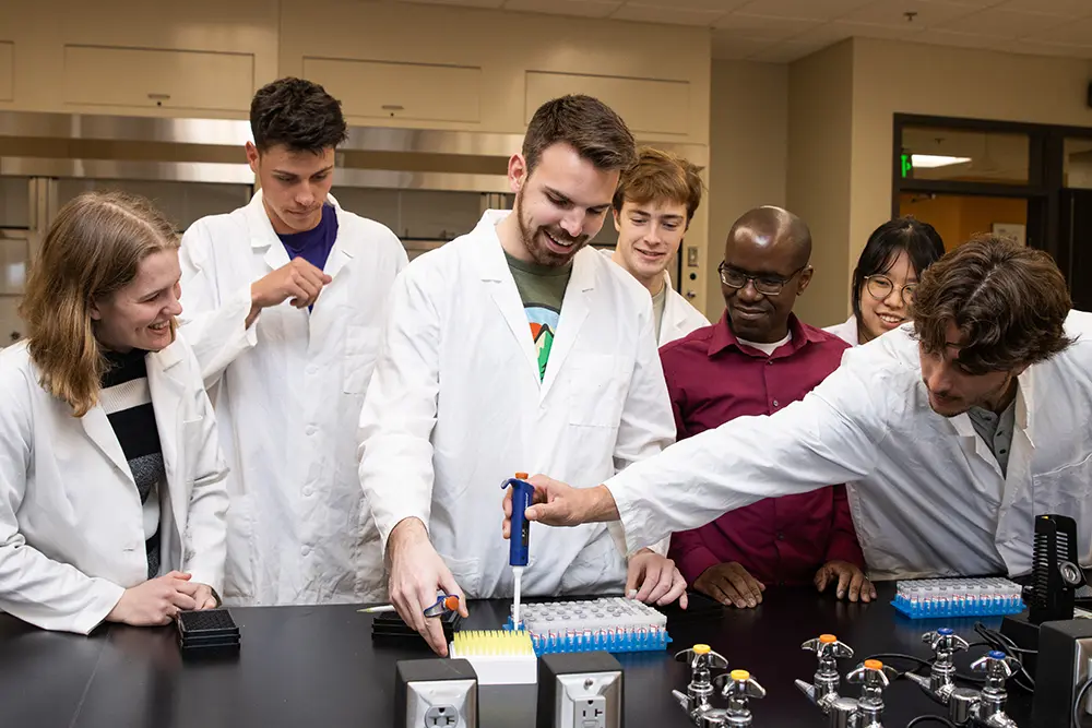 professor and students in lab
