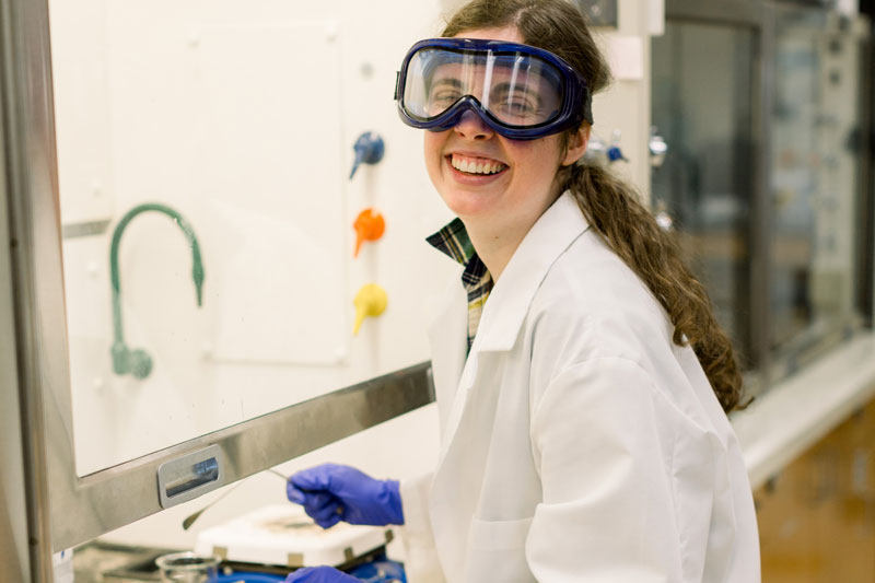 smiling female student in lab