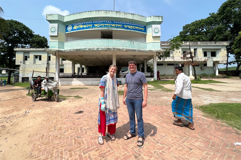 engineering students stand next to hospital in Bangladesh