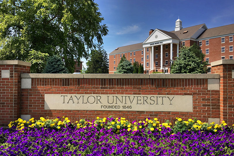 Taylor University Sign in front of Samuel Morris Hall