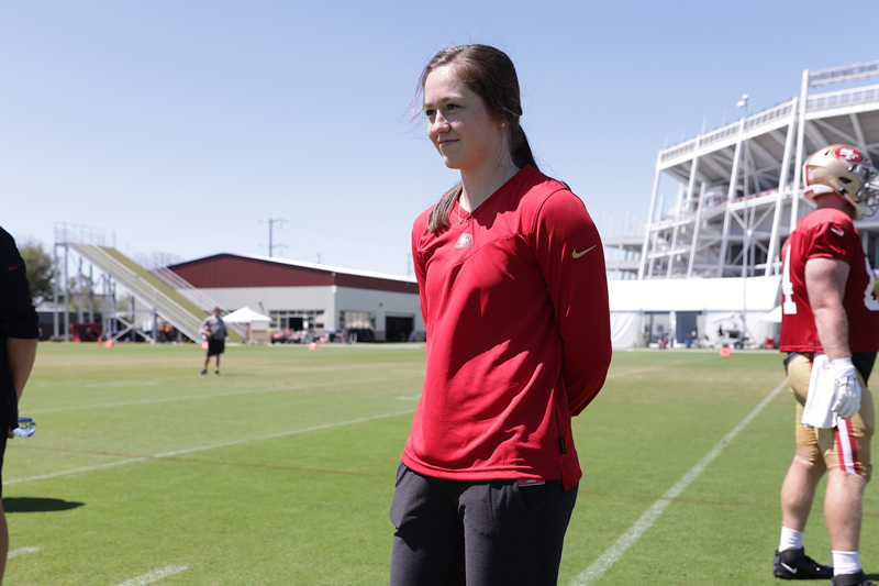 Lauren on the football field during her internship