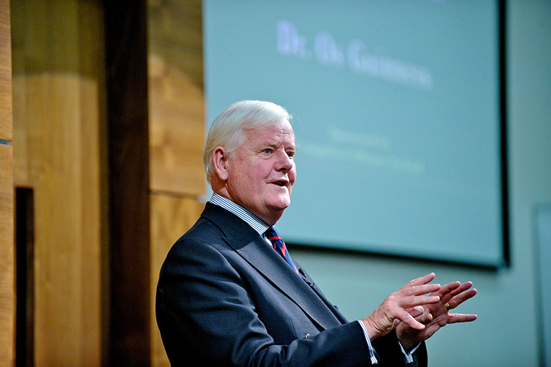 Os Guinness speaking at an event