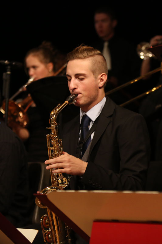 Student playing the saxophone in the Jazz Band
