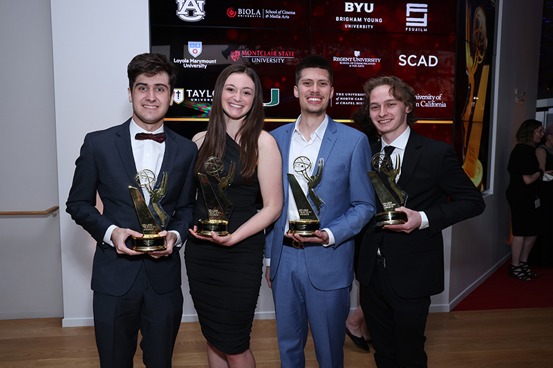 film students holding trophies