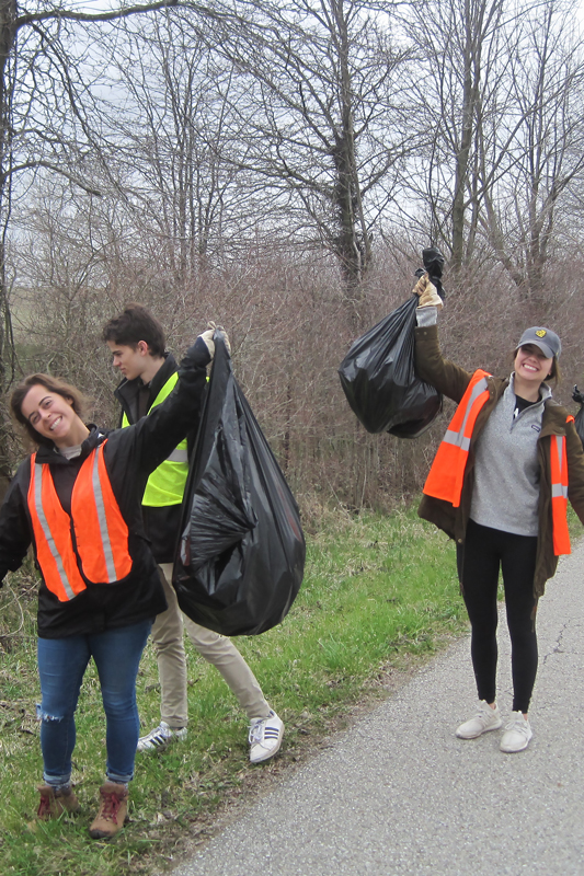 students picking up trash in the community