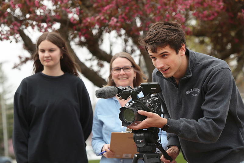 students and film faculty working on a film