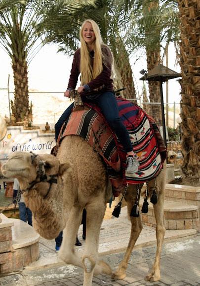 Girl riding a camel