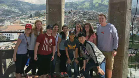 Taylor students at the top of a tower overlooking a city