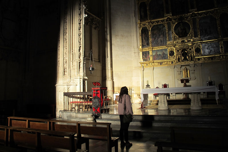 Student looking at the front of a cathedral in a foreign church