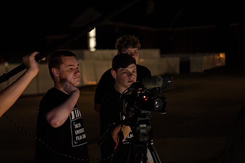 students recording at night