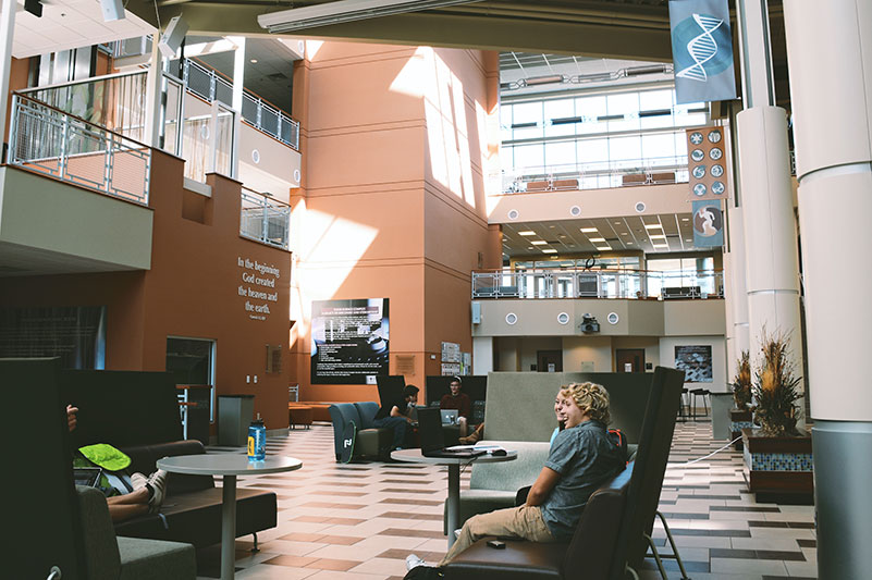 students sitting in the Euler Science Complex atrium