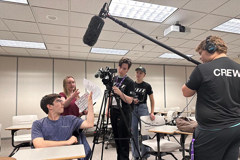 students recording in a classroom