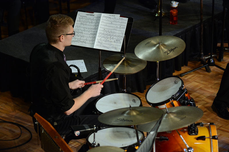 Student playing the drum set in Jazz Band