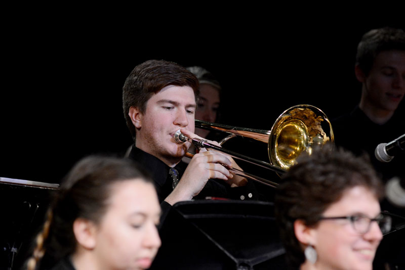 A student playing trombone in jazz band