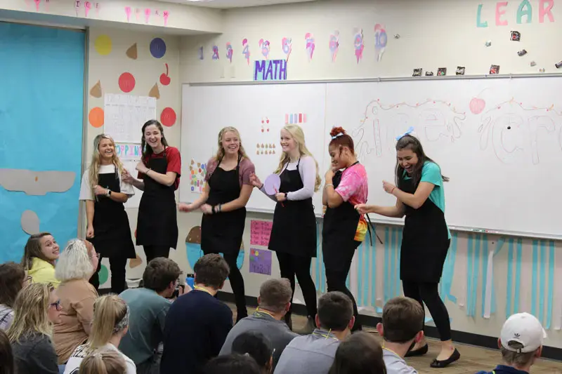A group of Elementary Education majors dancing in front of a class
