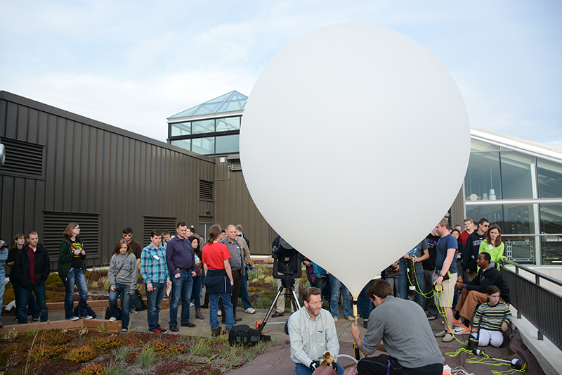 Students and faculty members at a balloon launch