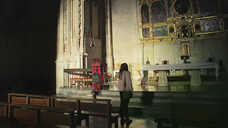 Female student looking at art in a cathedral