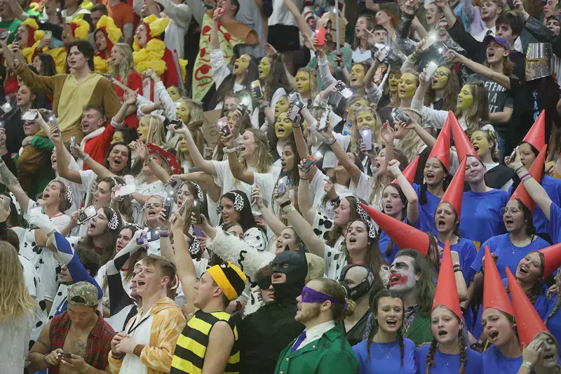 group of students in costumes at the Silent Night basketball game