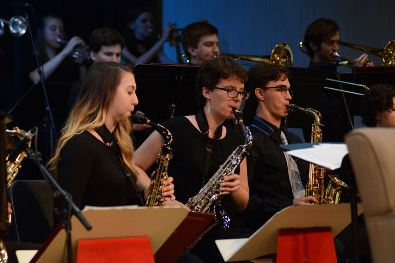Students playing saxophone in jazz band