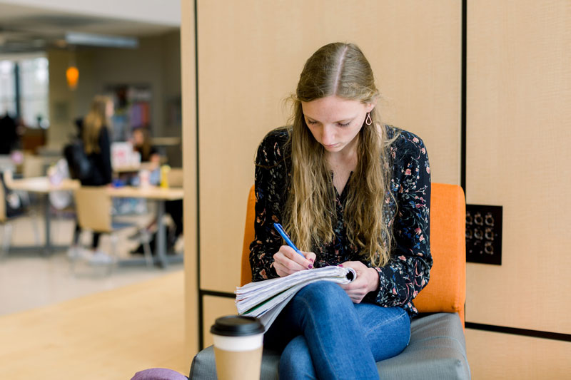A student studying on the stage in LaRita Boren Campus Center