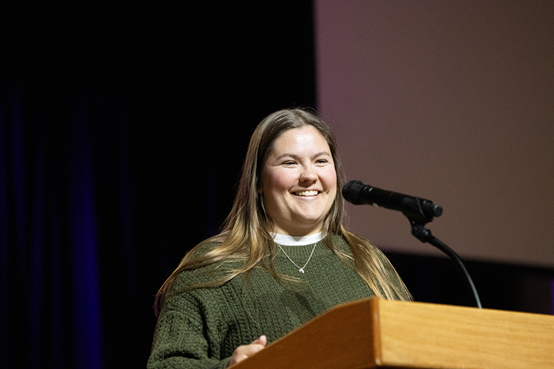 female student speaking in chapel