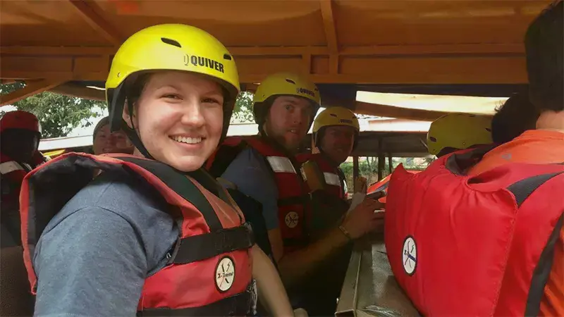 Taylor Sociology students on a bus with helmets and lifejackets