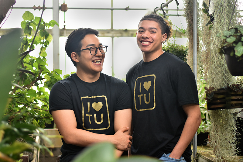 students laughing in the greenhouse