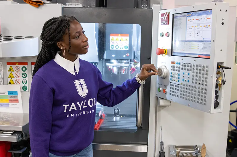 engineering girl working with machine