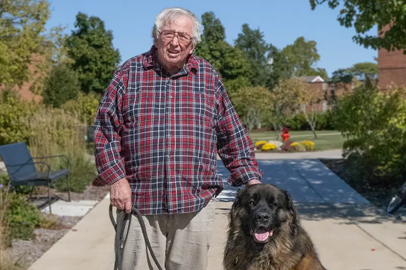 Veteran’s Career Spans Taylor, the Coast Guard, Photography, and Therapy Dogs