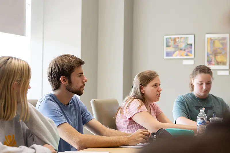 Students sit in a classroom 