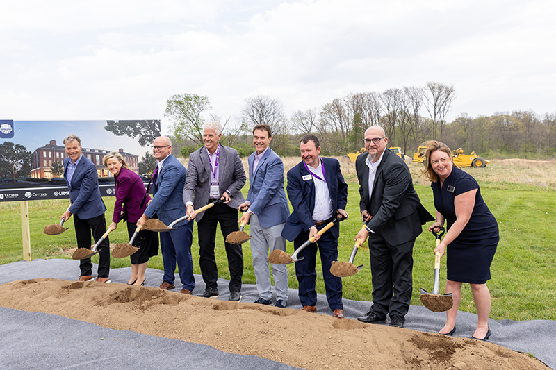 leadership holding shovels at groundbreaking ceremony