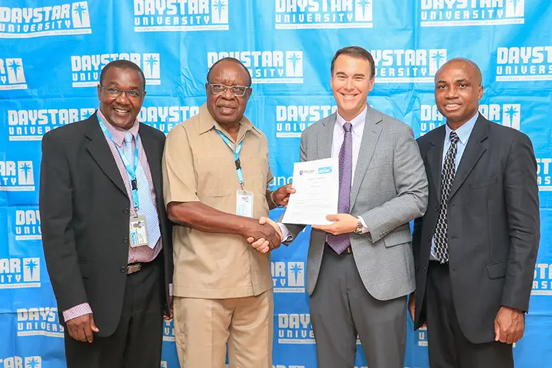 Michael Lindsay and Daystar leaders standing