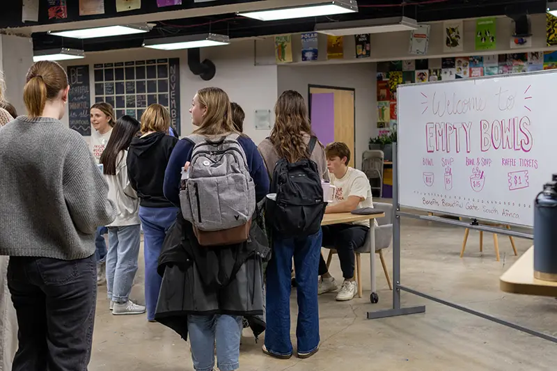 students lined up for empty bowls