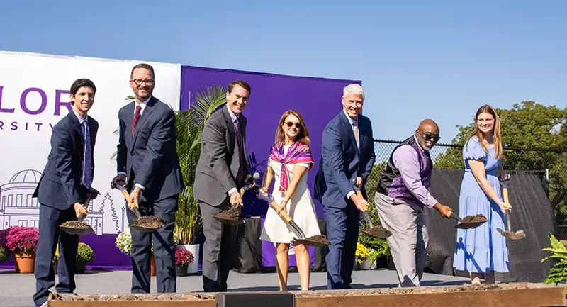 university leadership on stage at breaking ground