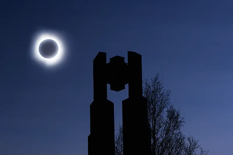 solar eclipse totality behind bell towers