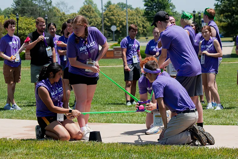 students launch water balloon