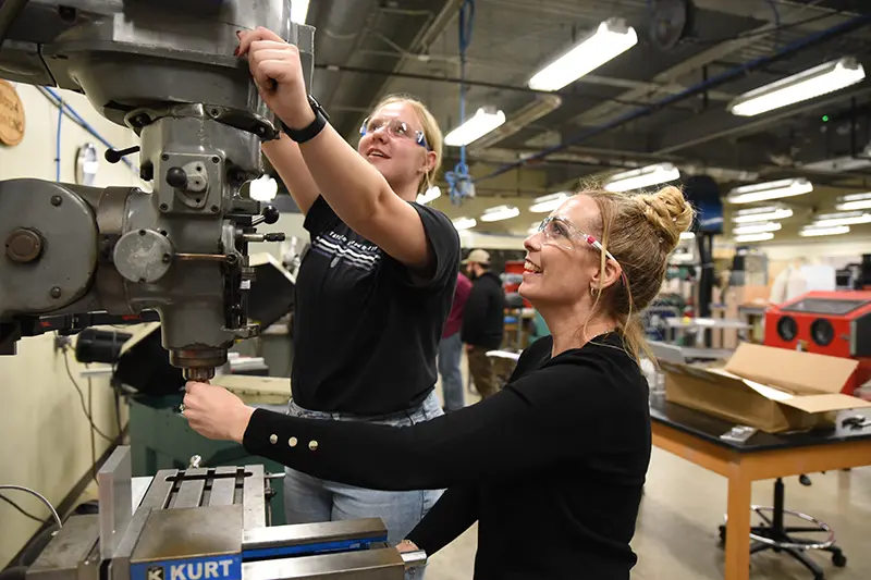 Engineering professor and student working on project