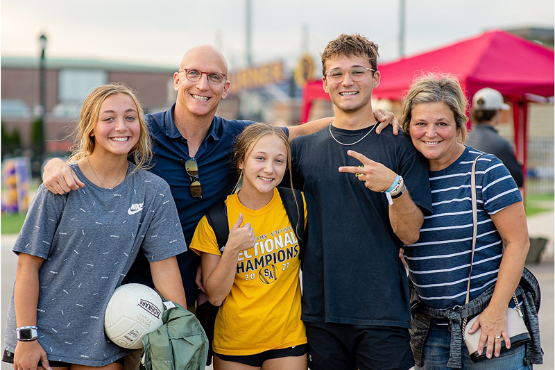 parents and student outside turner stadium
