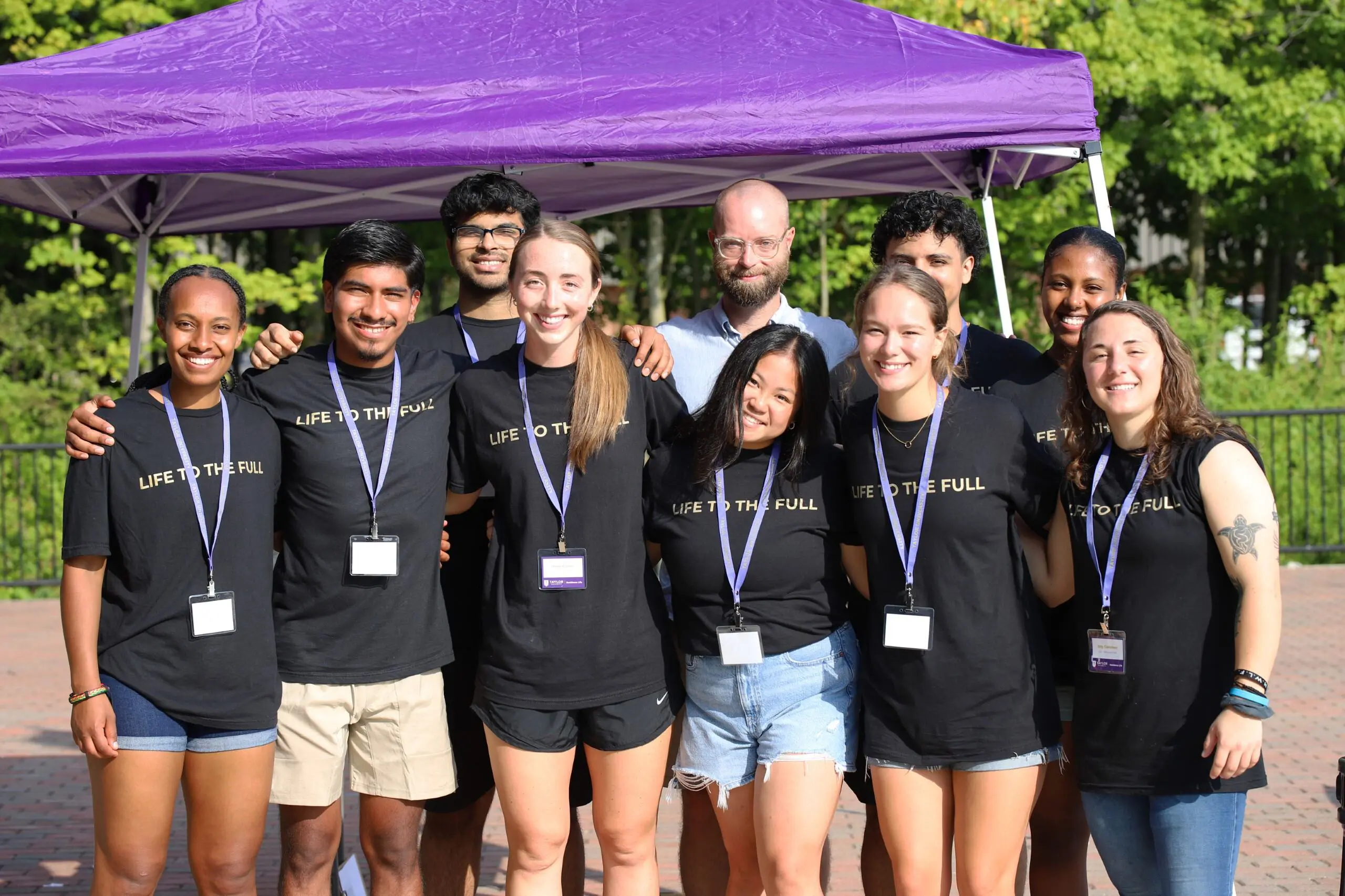 group of Taylor students outside residence hall