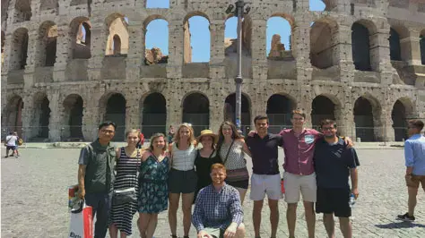 Taylor students standing in front of the Roman Colosseum
