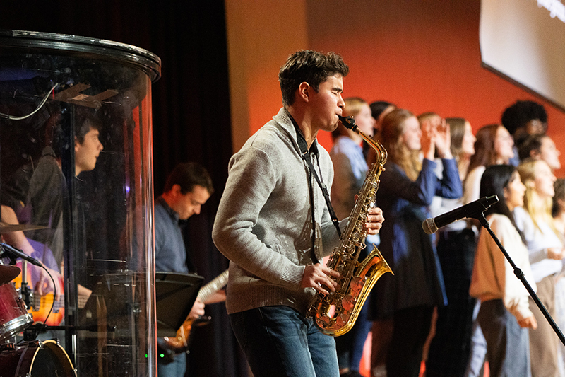 Student playing saxophone in Chapel
